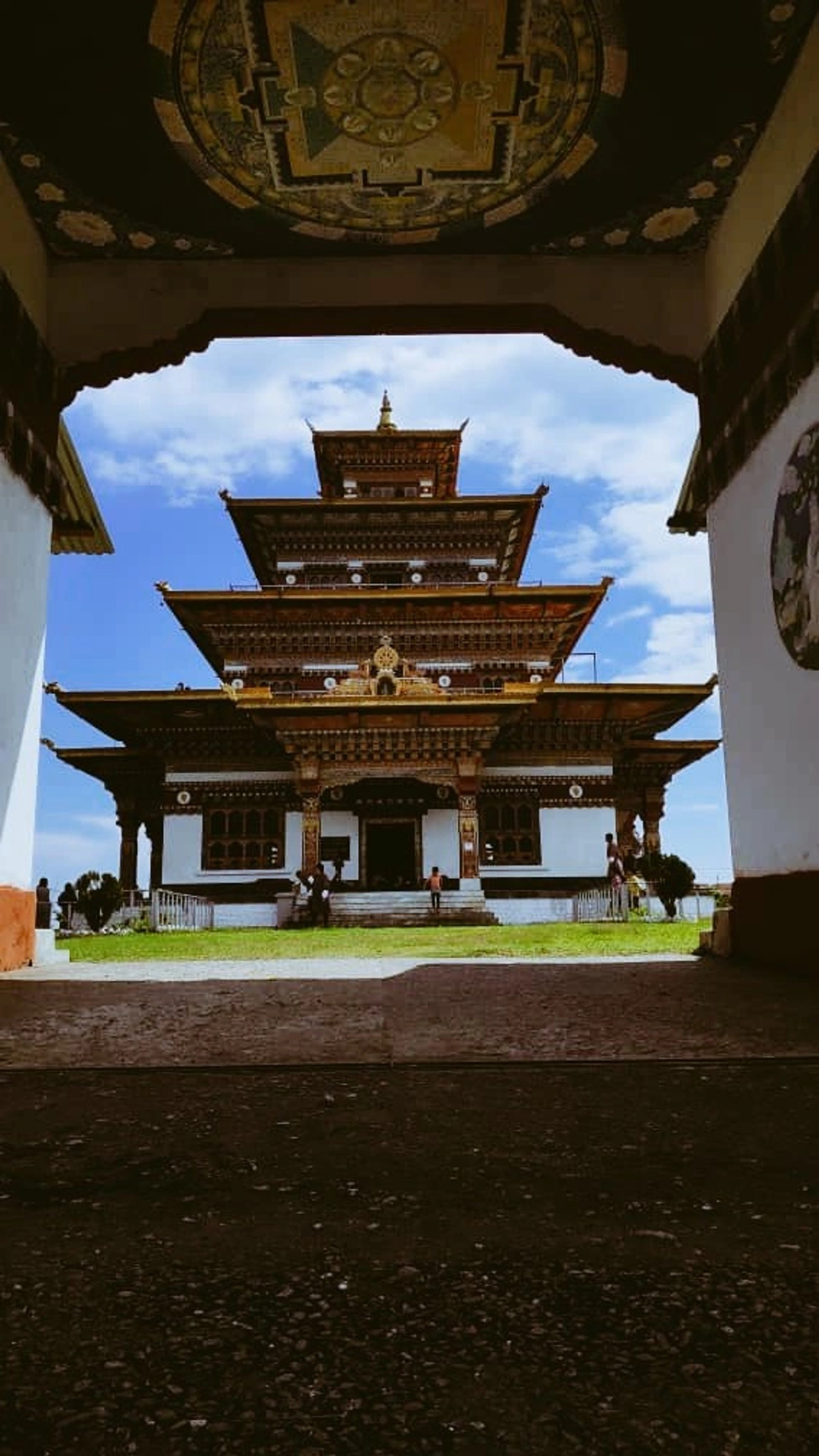 The palace of Zangdok Palri, seen through a gateway